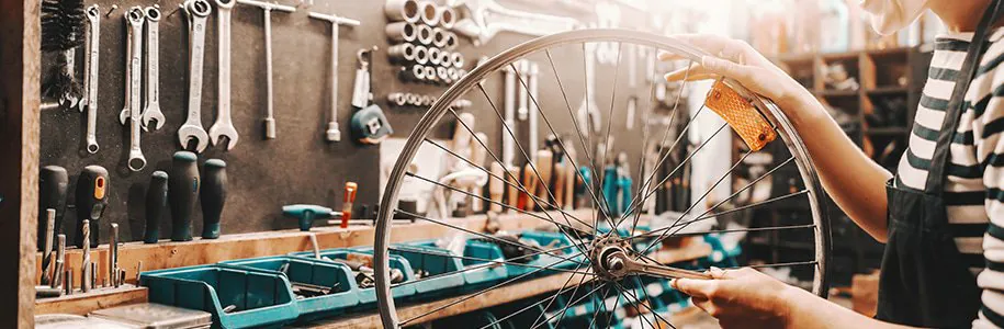 Illuminated bycicle wheel in workshop